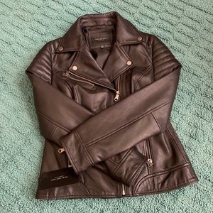Woman’s black leather biker jacket